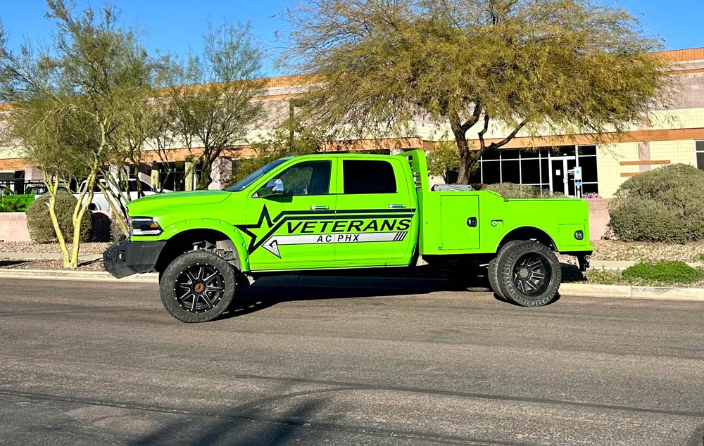 Bright green Veterans AC service truck